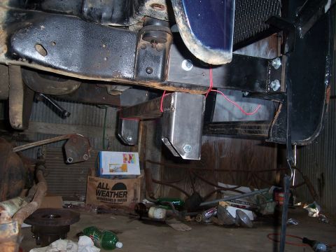 1983 Ford Bronco - Close-up view of custom front crossmember and bumper brackets, with red wires visible.