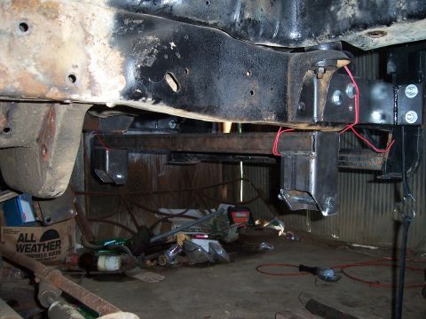 1983 Ford Bronco - Undercarriage view shows custom metal fabrication and wiring on a vehicle's frame.