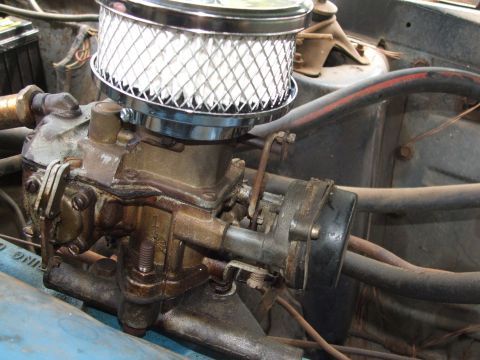 1966 Ford Ranchero - Carburetor assembly with chrome air cleaner, part of an engine bay.