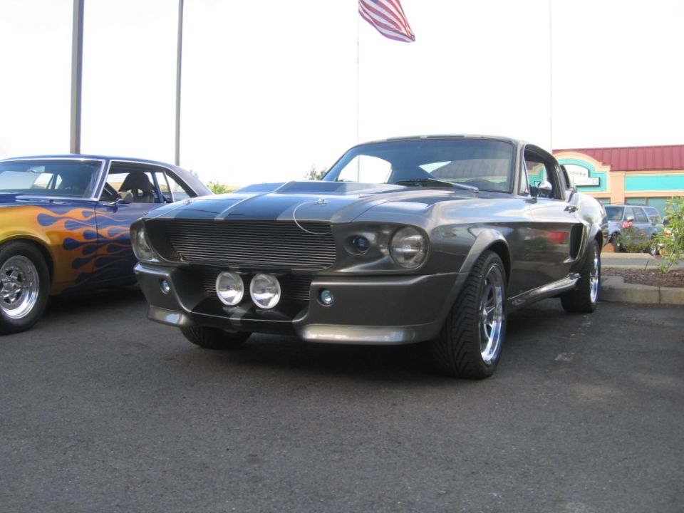 Gray 1967 Shelby GT500 with racing stripes and hood scoop