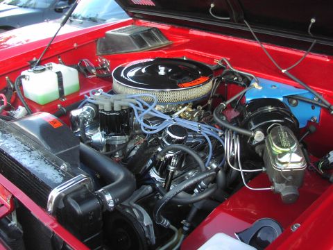 1979 Ford Bronco - Close-up view of a vehicle's engine compartment, showing various engine components.