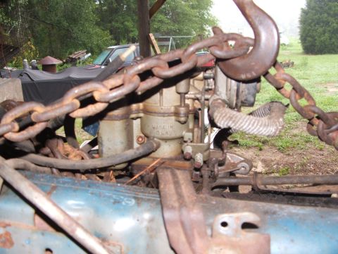 1966 Ford Ranchero - Carburetor and engine components are shown with a heavy-duty lifting chain attached.