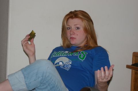 1998 Jeep TJ - Woman holding a pickle while sitting down.