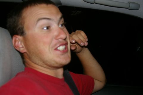 1998 Jeep TJ - A man makes a humorous expression while inside a car.
