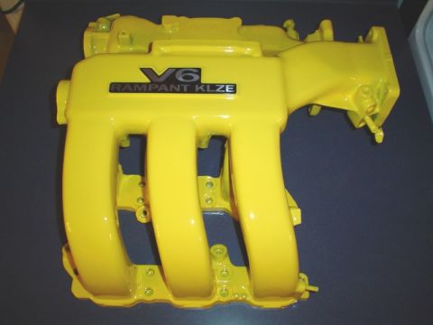 1995 Ford Probe - A yellow V6 intake manifold with "RAMPANT KLZE" text is shown against a dark background.