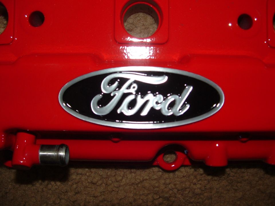 Red Ford valve cover with black oval Ford emblem