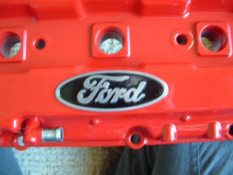 1995 Ford Probe - Close-up of a red Ford valve cover with the iconic Ford oval emblem.