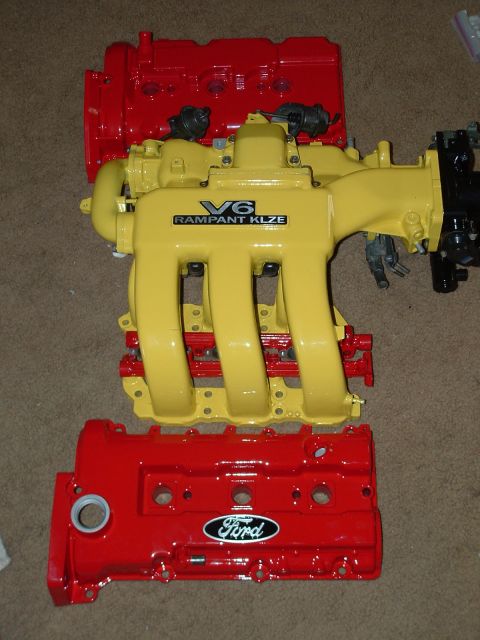 1995 Ford Probe - Engine components, including valve covers and an intake manifold, are displayed.