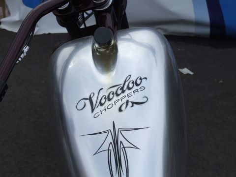 1997 Jeep TJ - Close-up of a motorcycle's fuel tank the Voodoo Choppers branding and custom pinstripe graphics.