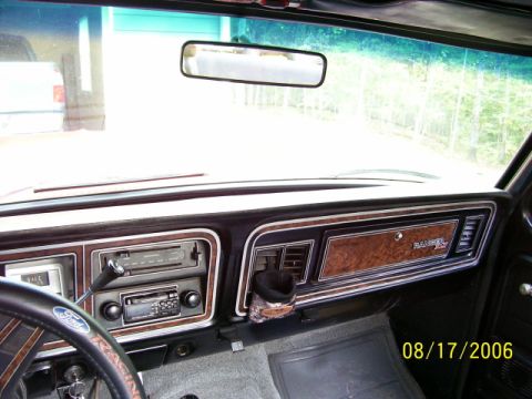 1979 Ford Bronco - Interior view of a 1979 Ford Bronco dashboard, showing the center console and steering wheel.