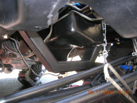 1996 Ford Bronco - Undercarriage view of a vehicle's fuel tank and suspension system.