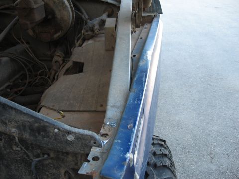 1977 Ford F-150 - View of the engine bay and fender area of a truck, with visible wiring and metal components.