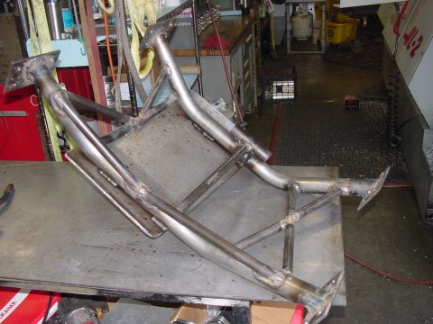 1979 Ford Bronco - This appears to be a custom-fabricated metal part, possibly for off-road or heavy-duty use, resting on a workbench.