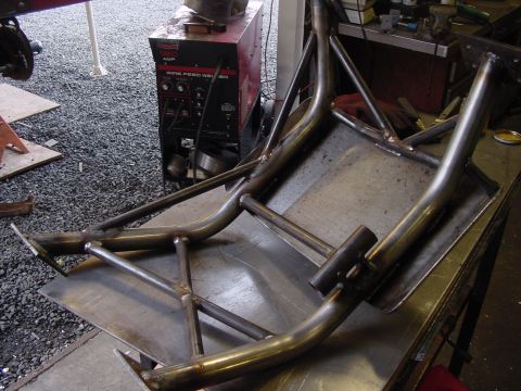 1979 Ford Bronco - Custom metal part fabricated on a workbench, with a wire feed welder visible.