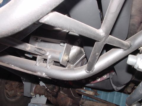 1979 Ford Bronco - Close-up view of the undercarriage, showing suspension and roll cage elements.