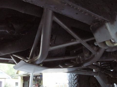 1979 Ford Bronco - Close-up view of the underbody and skid plate, revealing suspension and frame structure.