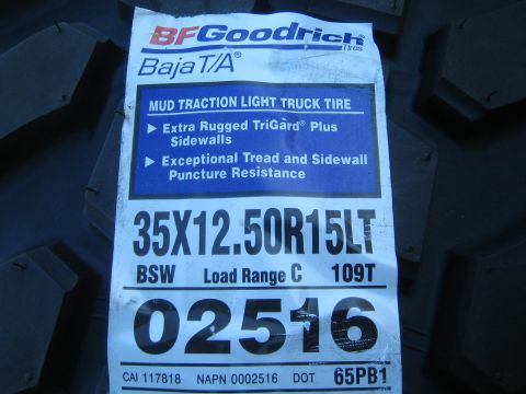 1990 Ford Bronco - BFGoodrich Baja T/A tire label specifying size 35X12.50R15LT, load range C, against the tread.