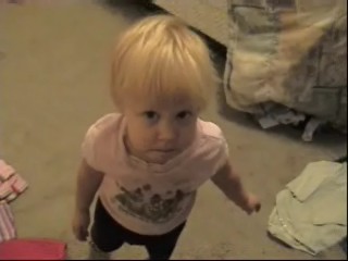 1993 Ford Taurus - A child stands in a room, looking up at the camera.