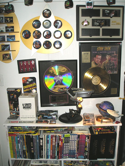1984 Pontiac Fiero - A collection of Star Trek memorabilia adorns a wall and shelves, various collectibles and books.