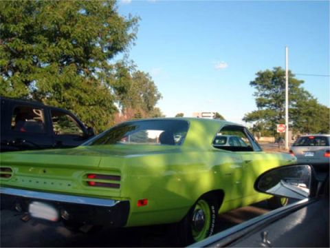 1971 Ford Ranchero - Lime green 1970 Plymouth Road Runner coupe seen from the rear, with other vehicles nearby.