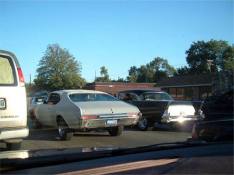 1971 Ford Ranchero - Rear view of a classic 1957 Chevrolet Bel Air, notable for its prominent tail fins.