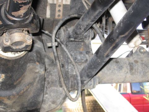 1994 Ford Bronco - Undercarriage view showing driveshaft and suspension parts, with some wiring visible.