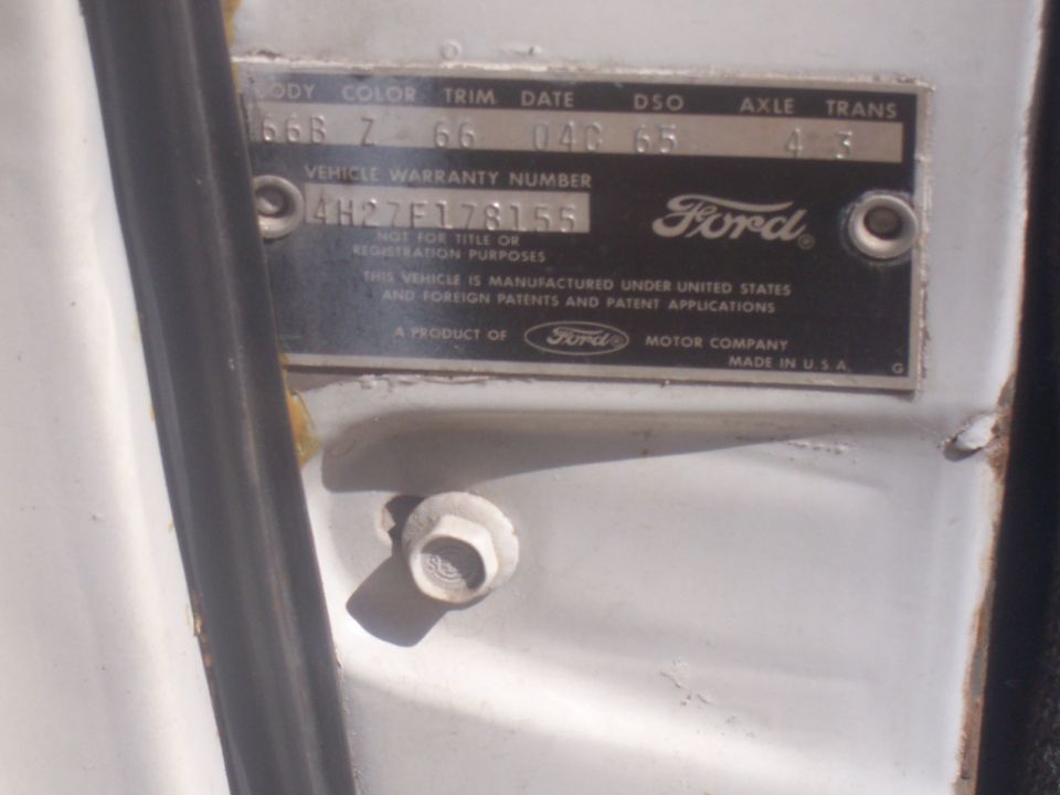 Ford door jamb warranty plate with body, color, trim, date, DSO, axle and trans codes