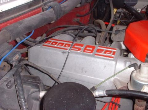 1989 Ford Bronco - Close-up of a Ford 5.8L engine valve cover, likely from a 1989 Bronco.