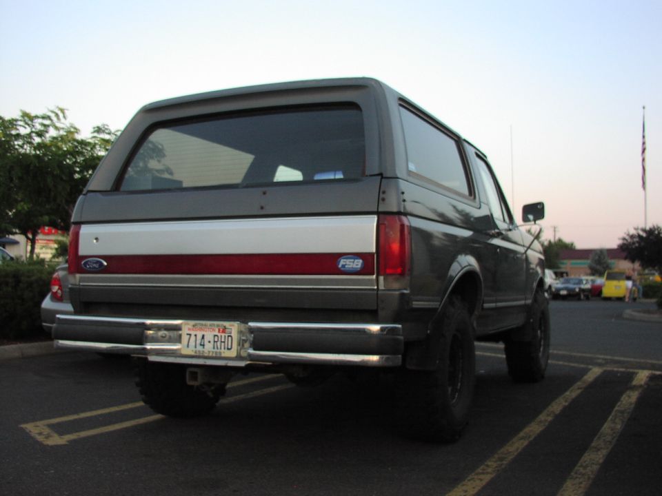 Rear view of a 1979 Ford Bronco with a license plate reading 714-RHD
