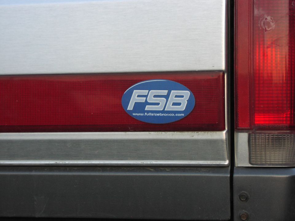 FSB sticker on a Ford Bronco rear panel, next to taillight. Sticker reads www.fullsizebronco.com