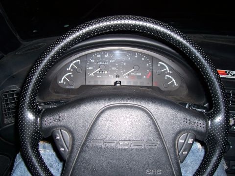 1994 Ford Probe - Interior view of a 1994 Ford Probe, showing the dashboard gauges and steering wheel.