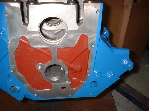 1967 Ford Fairlane - Close-up of a painted engine block, showing internal casting details and gasket mating surfaces.