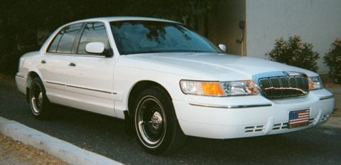 2001 Mercury Grand Marquis - Front 3/4 view of a white 2001 Mercury Grand Marquis sedan.