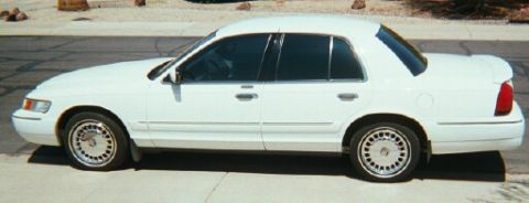 2001 Mercury Grand Marquis - Roush Performance spoiler and LS wheel covers.