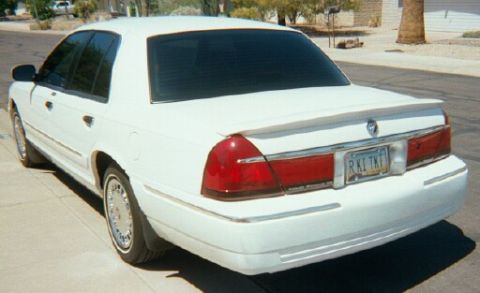 2001 Mercury Grand Marquis - Roush Performance spoiler and LS wheel covers.
