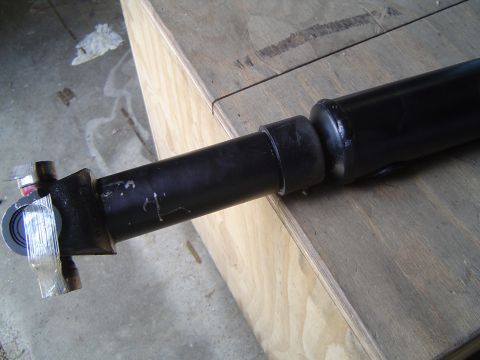 1989 Ford Bronco - Close-up of a driveshaft part, likely for a vehicle's drivetrain.