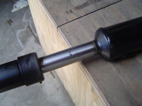 1989 Ford Bronco - Close-up view of a vehicle driveshaft, showing its component parts and construction.