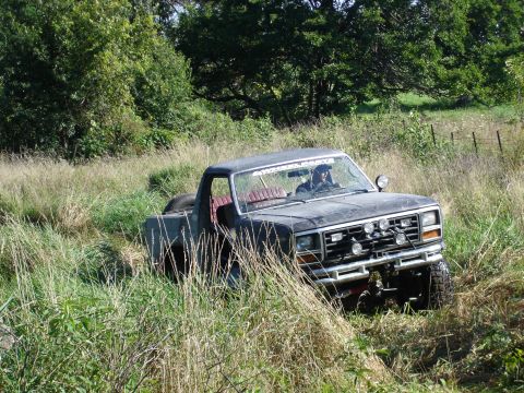 1979 Ford Bronco - This 1979 Ford Bronco navigates through a grassy field, its off-road capabilities.