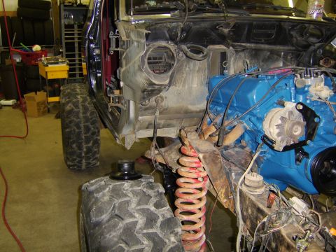 1986 Ford Ranger - This vehicle is undergoing repairs, with its engine and front-end components exposed.