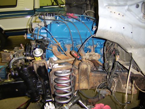 1986 Ford Ranger - Engine bay components during a repair, showing the engine block and suspension parts.