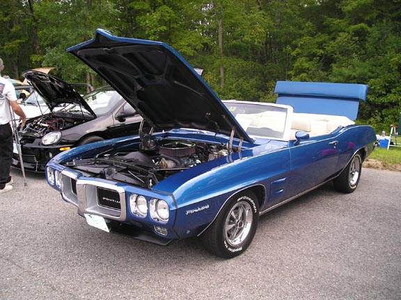 Blue 1969 Pontiac Firebird convertible, front 3/4 view, hood open