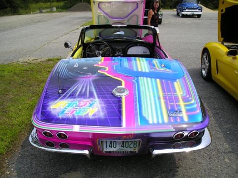 1984 Pontiac Fiero - Customized 1963 Chevrolet Corvette Sting Ray convertible displays vibrant airbrush art on its rear.