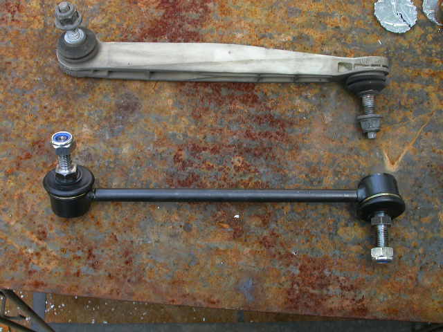 Cheesy Ford Taurus front sway bar end link vs. MOOG replacement.  Unbelievable.