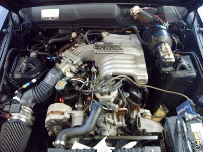 1973 Ford Ranchero - The engine bay shows a Ford 5.0 HO V8 engine, likely from a later model Mustang or similar vehicle.