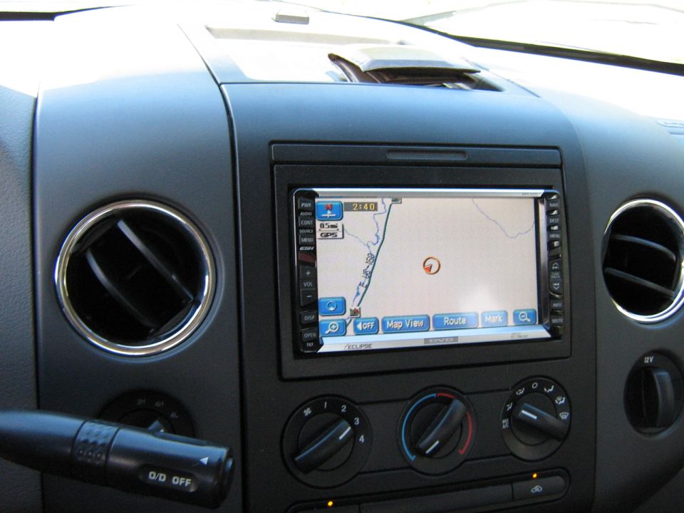 Eclipse navigation head unit in a Ford truck dash above rotary climate controls