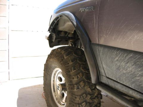 1997 Ford Ranger - Close-up of a Ford Ranger's fender and tire, showing the 'RANGER' badge.