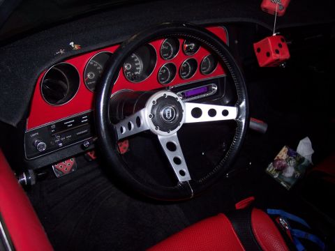 1972 Ford Ranchero - The dashboard features a red panel with multiple gauges and an aftermarket stereo system.