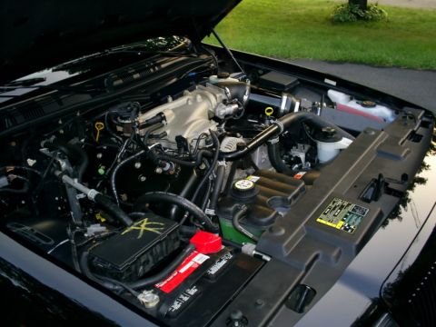 2003 Mercury Marauder - Engine bay of a black 2003 Mercury Marauder, showing the V8 engine and associated components.