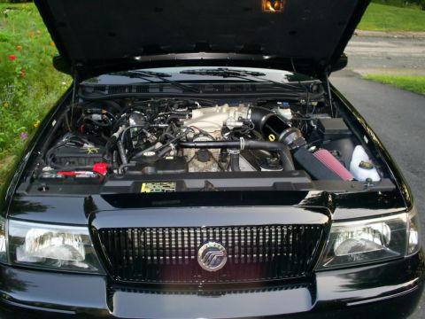 2003 Mercury Marauder - Engine bay of a 2003 Mercury Marauder, showing the V8 engine and aftermarket cold air intake system.