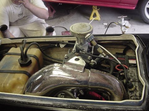 1995 Ford Mustang - Close-up view of a jet ski engine, showing its internal components and chrome exhaust system.
